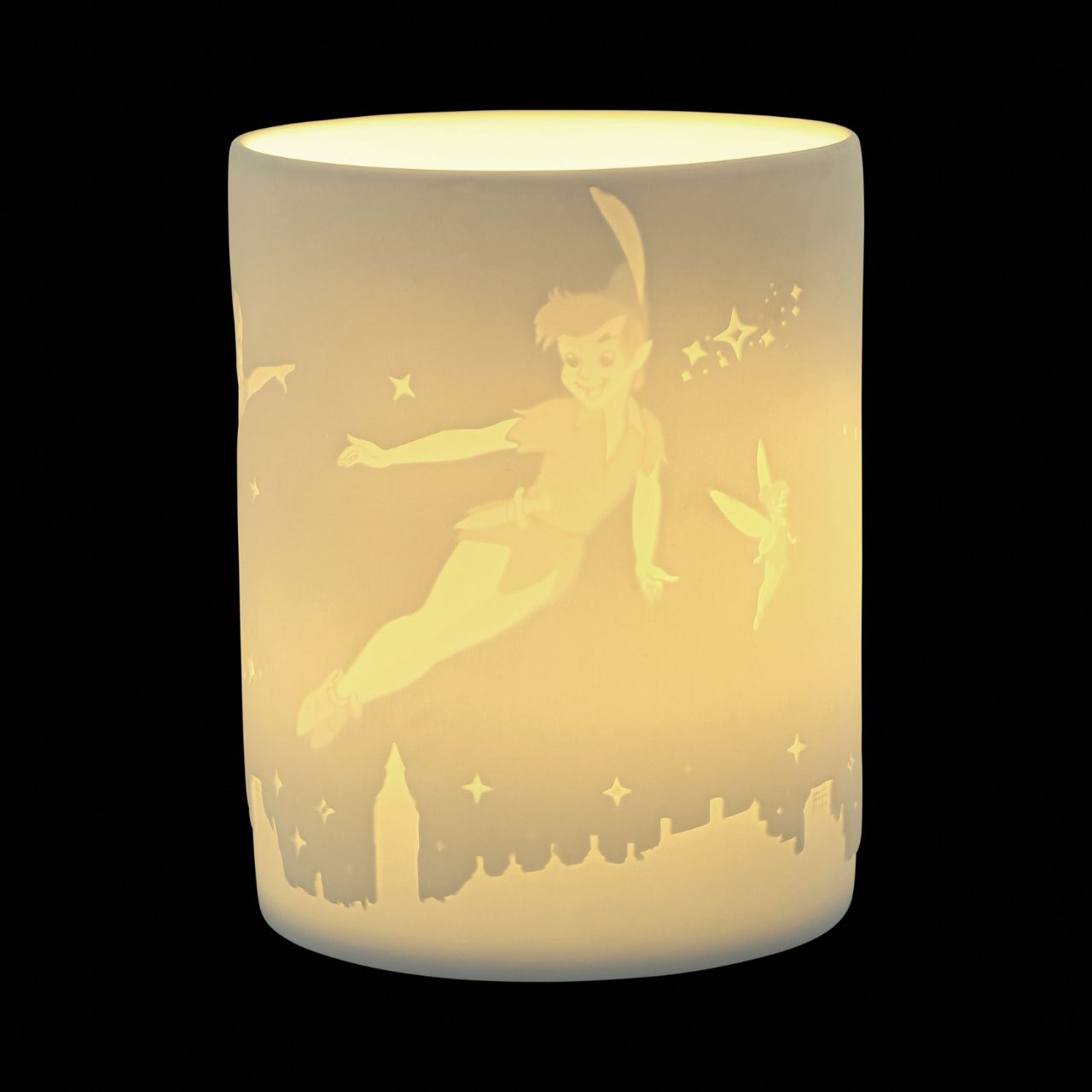 Disney Peter Pan Tea Light Holder Never Land's Waiting  Celebrate Peter Pan's 70th anniversary in 2023 with this one of a kind Disney porcelain tea light holder. Leave the world behind and bid your cares goodbye when you see Peter Pan, Tinker Bell, Wendy, John and Michael flicker around your room when you light the LED candle. The Peter Pan characters are etched into the thin translucent porcelain radiating a warm night light.