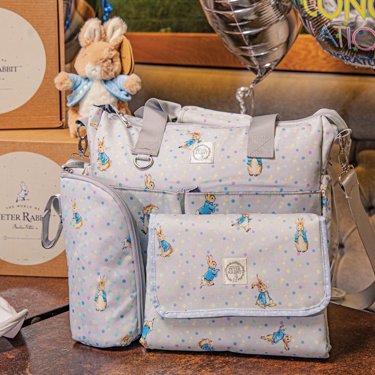 Beatrix Potter Peter Rabbit Insulated Bottle Bag  Our portable classic Peter Rabbit insulated bottle bag makes feeding on the go easy. Can be used to keep bottles hot or cold, ideal for your hungry little rabbit. The adorable design ensures it fits perfectly on your wrist, pram or bag. The design allows this bottle bag to be gender-neutrals and perfect for any baby shower gift.