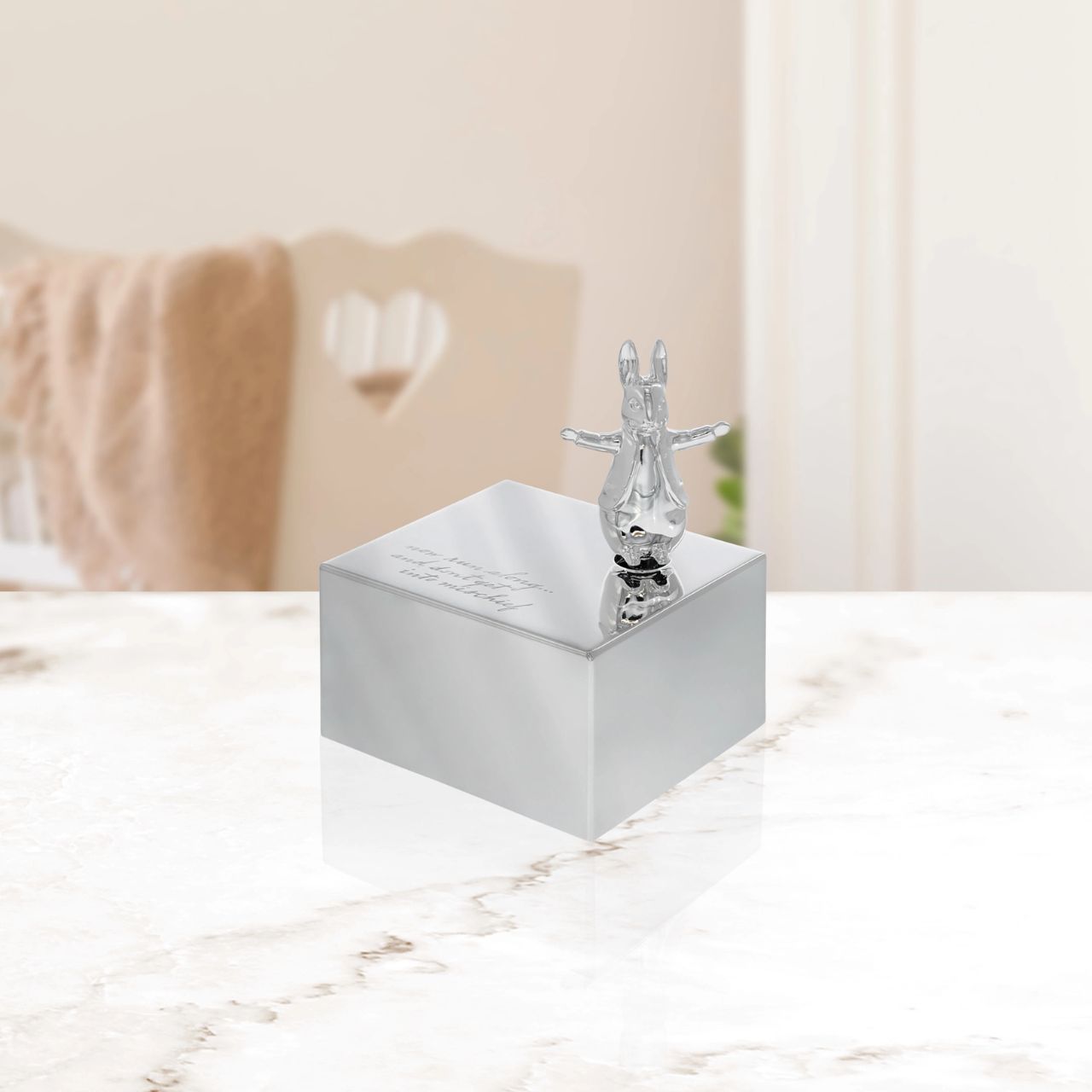 Celebrate a new bundle of joy with the Beatrix Potter New Baby collection. The silver-plated Music Box, with an adorable sculpted Peter Rabbit on top, makes a beautiful gift that will be treasured for years to come.