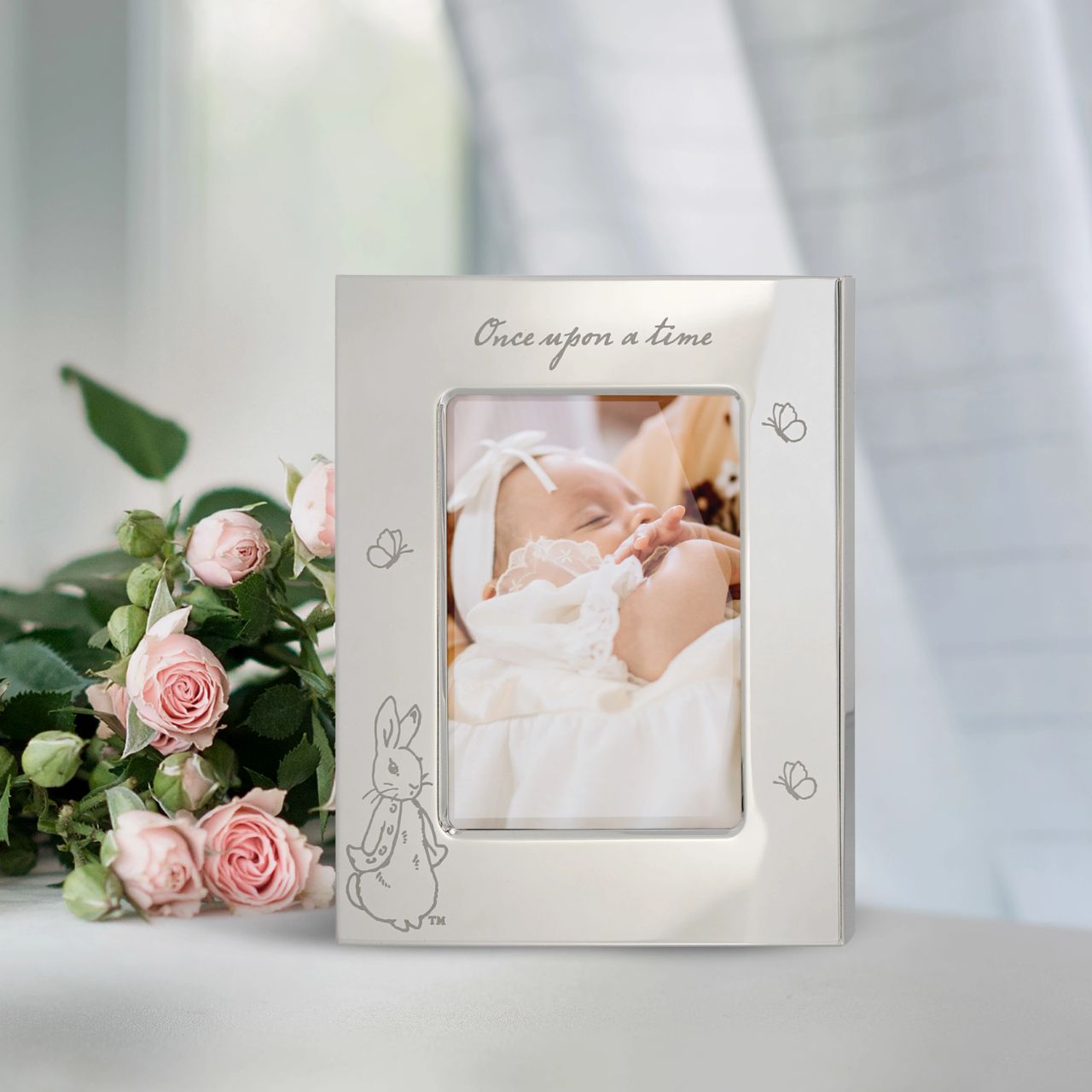 Celebrate a new bundle of joy with the Beatrix Potter New Baby collection. The silver-plated Photo Frame, with an adorable etched Peter Rabbit design, makes a beautiful gift that will be treasured for years to come.