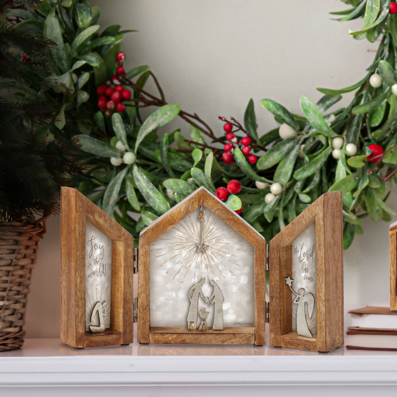 Artist, Wendy Wiinanen, crafts memorable moments of intrigue from mango wood and aluminium. This folding display not only frames the nativity space but also makes it easy for storing.