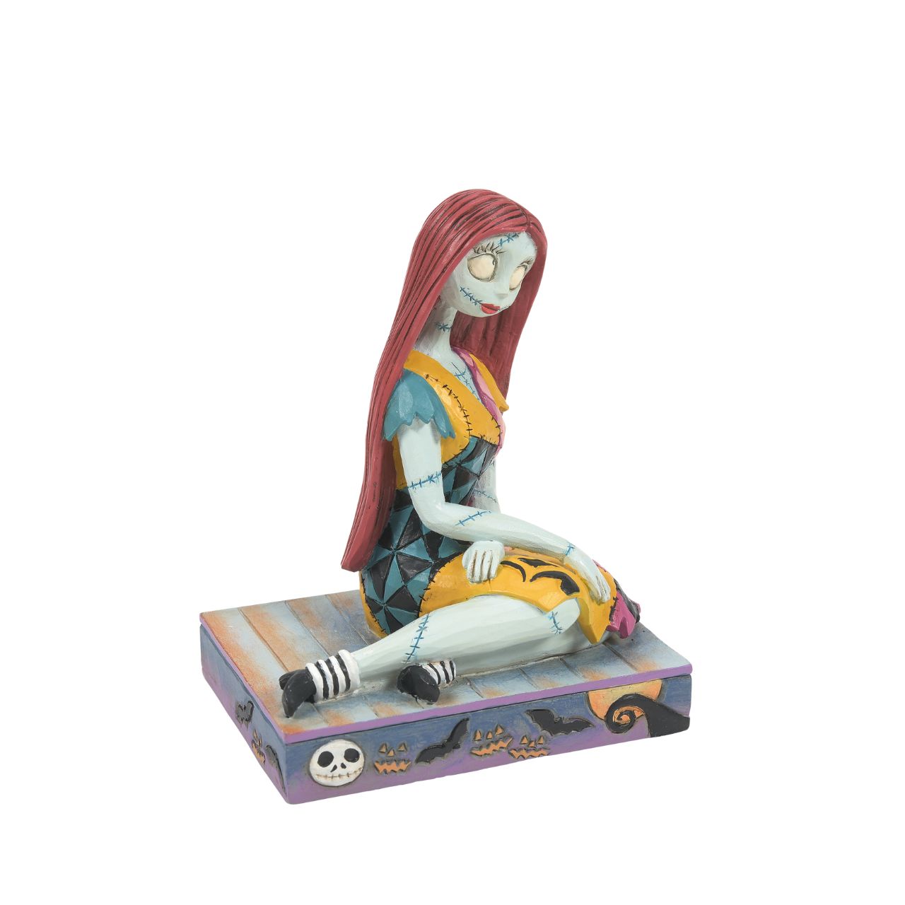 Sally from The Nightmare before Christmas is sat delicately on a Halloween themed base, which even features the face of her paramour, Jack Skellington. Designed by Jim Shore for Disney Traditions. The perfect gift for any fan. Comes in fully branded gift box.