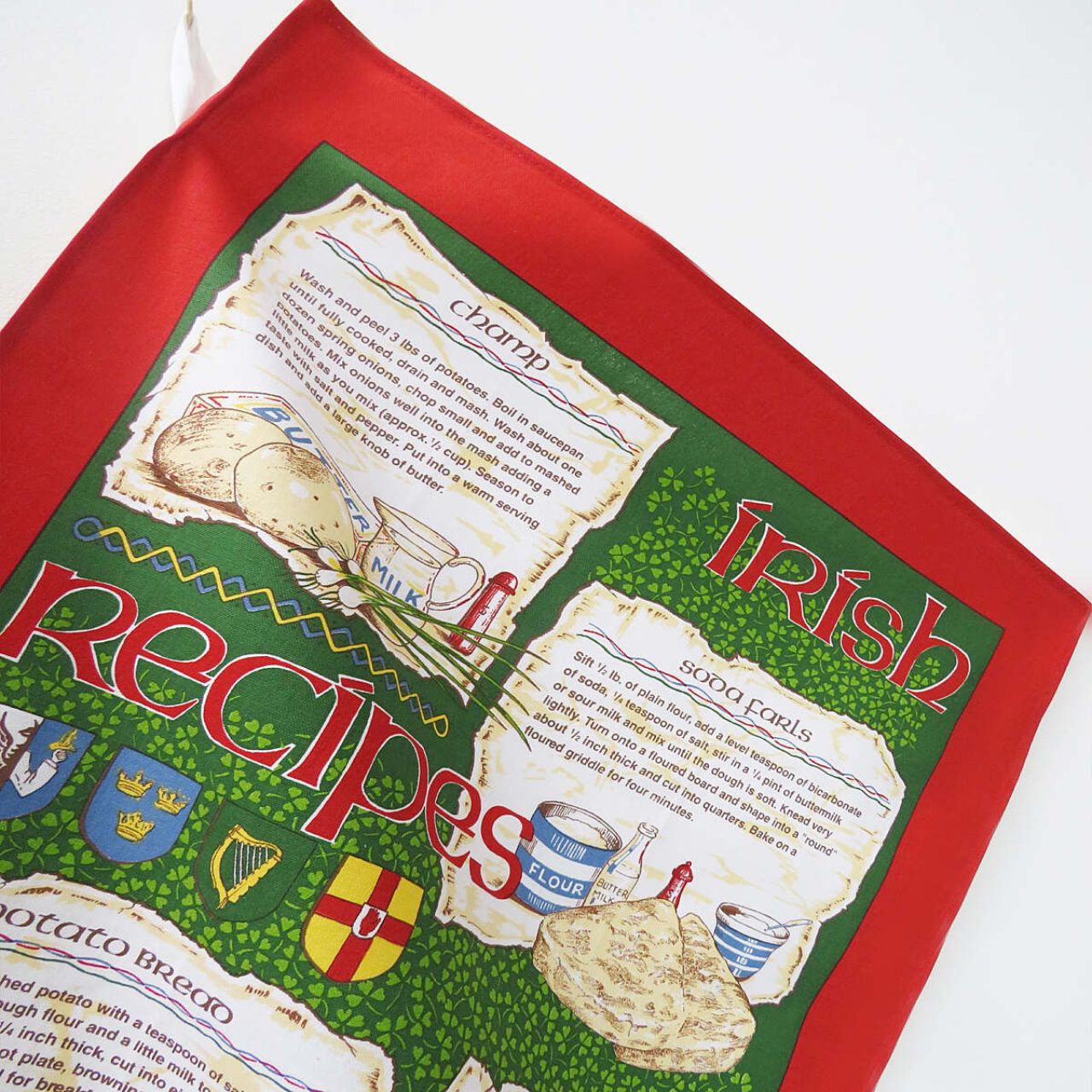 A traditional Irish tea towel inheriting a variety of well known Irish recipes. A beautiful Irish souvenir with vibrant red and green tones, including hand drawn and written motifs. Read easily whilst you cook with it's practical easy hang loop!