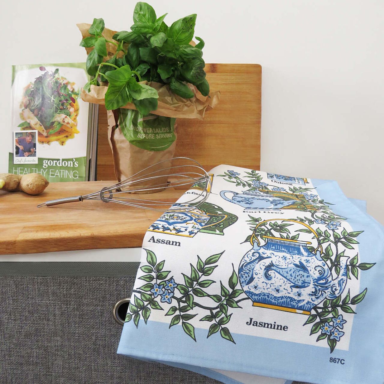 This beautifully hand drawn traditional Tea Time Cotton Tea Towel with elegant intricately designed crockery, complimented by delicate baby blue florals and earthy greens. This magnificent design is perfect for any lady or gent with a love of afternoon tea!