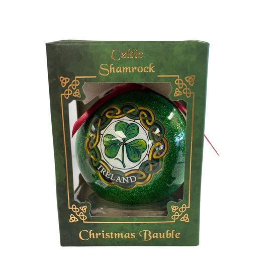 Experience the luck of the Irish this holiday season with our Shamrock Christmas Bauble. This bauble features a beautiful shamrock design, bringing a touch of Celtic charm to your Christmas tree. Perfect for those with Irish heritage or anyone looking for a unique holiday decoration.