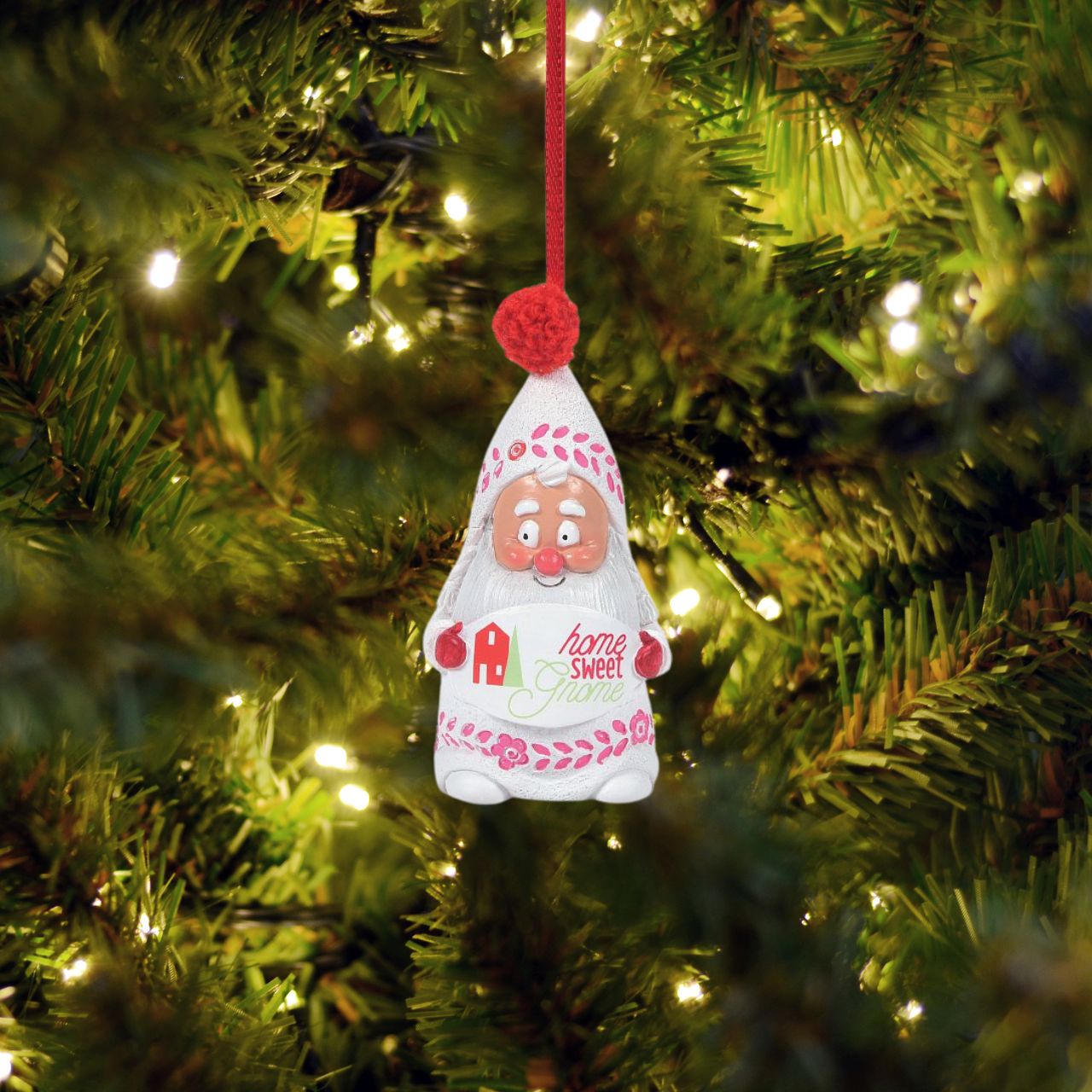 Celebrate your home with this Snow Gnome, Hanging on a red ribbon, he has been hand crafted from high quality cast stone and then hand painted by our talented artists. Perfect for any Christmas tree.