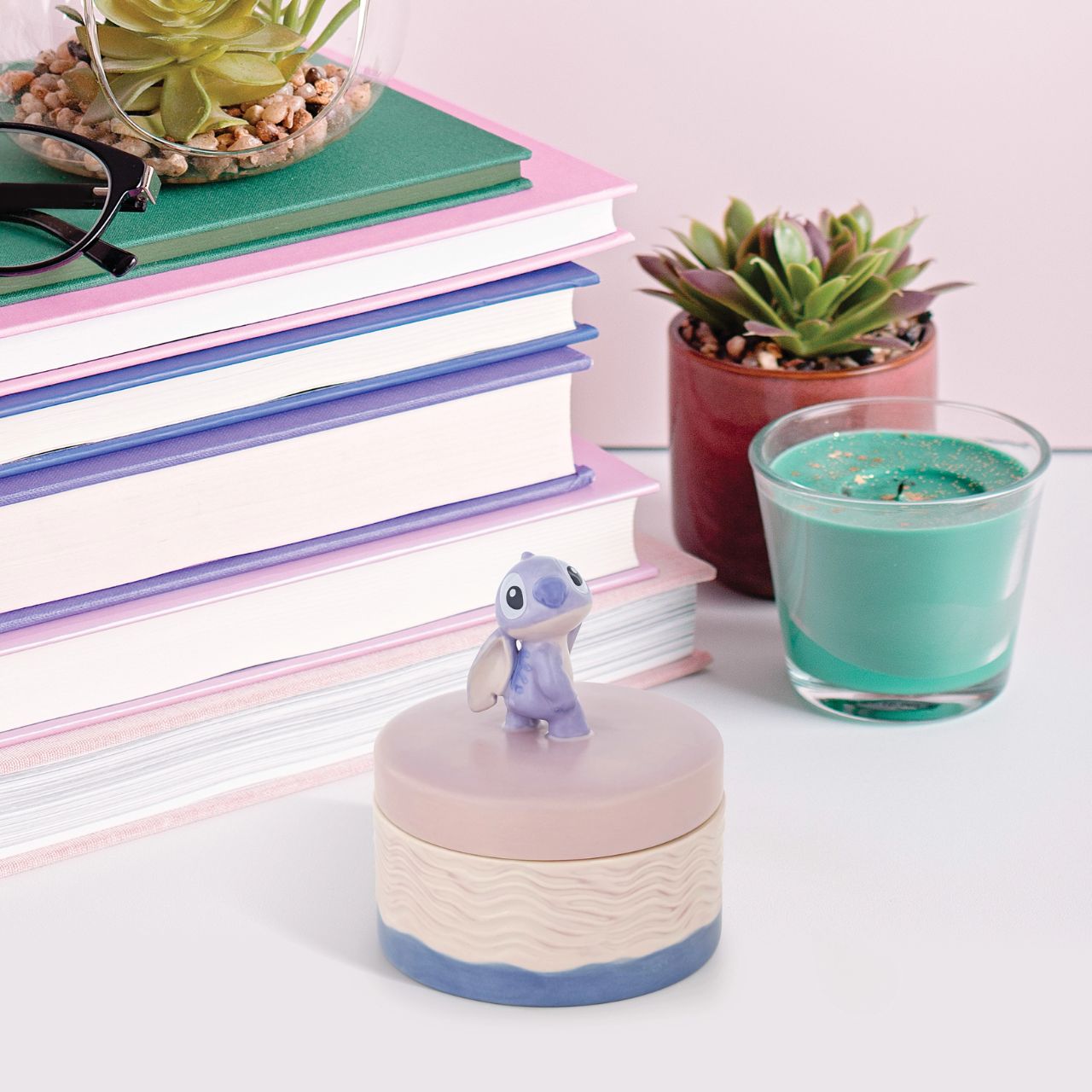 Discover magic within the Disney Stitch Keepsake Box. Adorned with a charming Stitch figurine handle, this whimsical box holds treasures while bringing joy to any space. Embrace nostalgia and keep your special mementos close with this delightful addition to your collection.