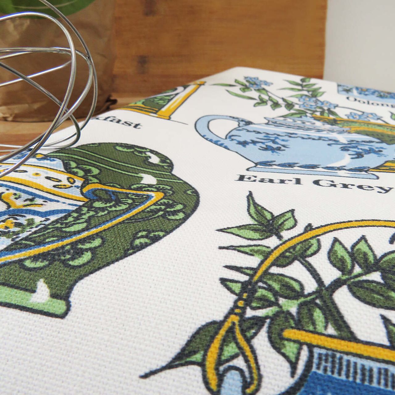 This beautifully hand drawn traditional Tea Time Cotton Tea Towel with elegant intricately designed crockery, complimented by delicate baby blue florals and earthy greens. This magnificent design is perfect for any lady or gent with a love of afternoon tea!