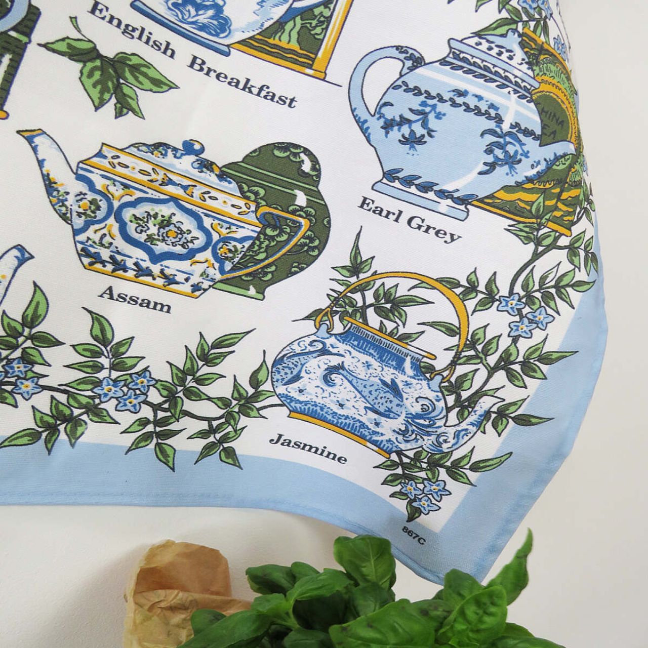 This beautifully hand drawn traditional Tea Time Cotton Tea Towel with elegant intricately designed crockery, complimented by delicate baby blue florals and earthy greens. This magnificent design is perfect for any lady or gent with a love of afternoon tea!