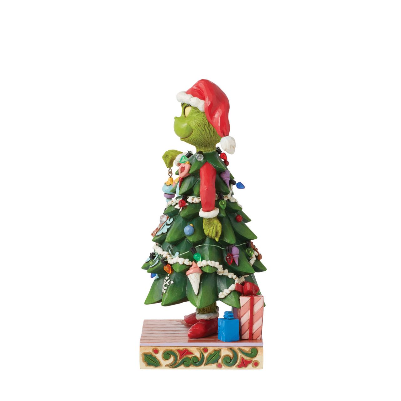 With a heart enlarged with holiday spirit and love, The Grinch smiles sincerely in this festive Jim Shore design. Dressed as a Christmas tree, Grinch wears a Santa hat and holds an ornament. This piece brings warmth to winter with decorative details.