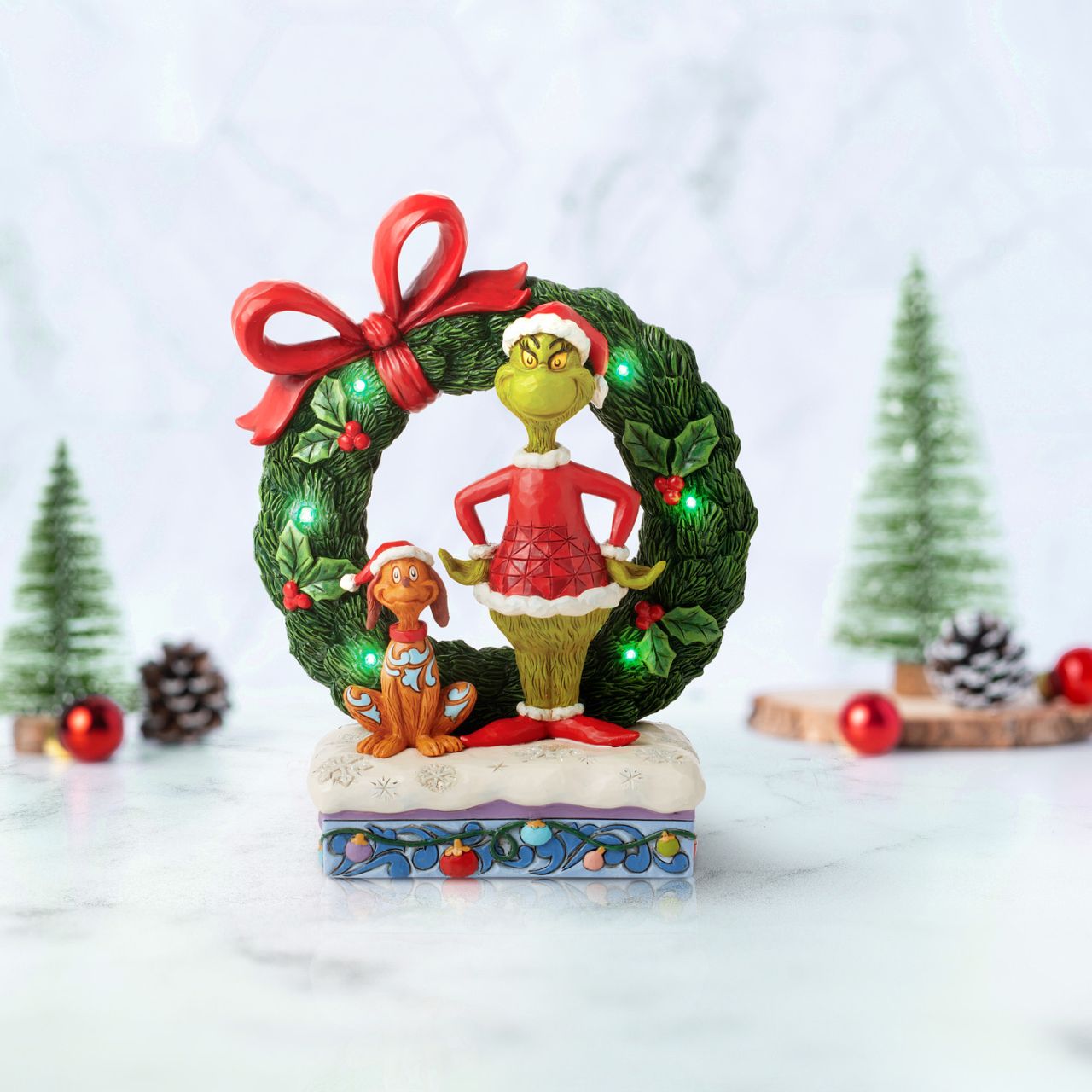 Designed by award-winning artist, Jim Shore, hand carved and hand painted, the iconic Grinch is ready to enjoy the Christmas holidays with this festive piece. Comes in a fully branded gift box.