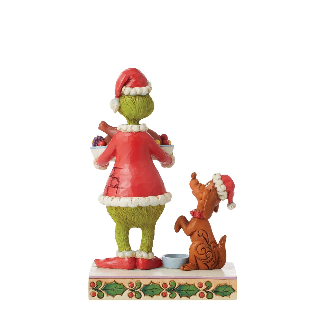 Dressed as Santa, the Grinch has prepared a spectacular Christmas feast for himself and best friend, his loyal dog, Max. Wearing Santa hat, Max sits pretty, patiently waiting for a turkey leg. This bright bust is masterly crafted by Jim Shore.