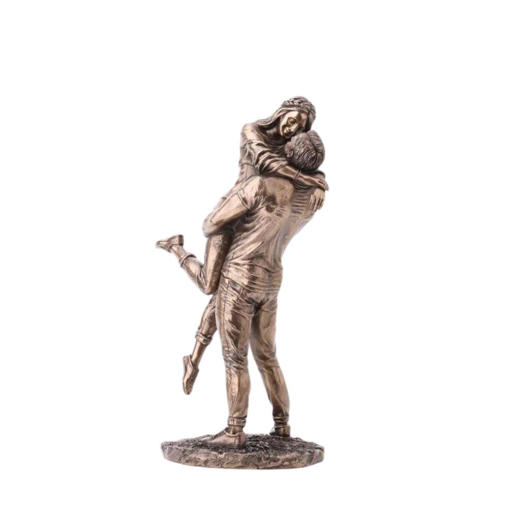 The Promise by Genesis Ireland  A beautiful bronze coloured statue of a couple in a loving embrace.  Perfect for art lovers or for an occasional gift such as a engagement or anniversary gift.