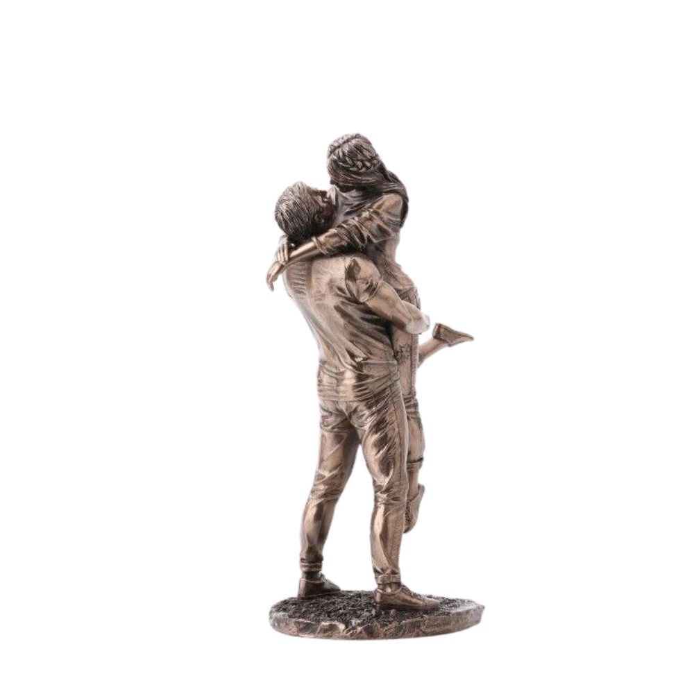 The Promise by Genesis Ireland  A beautiful bronze coloured statue of a couple in a loving embrace.  Perfect for art lovers or for an occasional gift such as a engagement or anniversary gift.