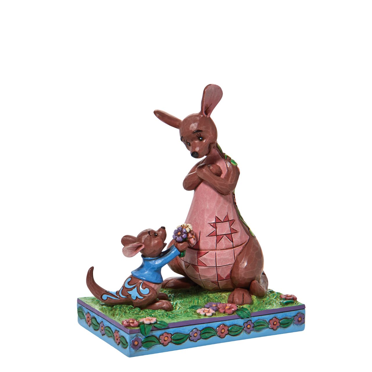 "The Sweetest Gift" The Winnie the Pooh crew enjoy Spring in the Hundred Acre Wood. Kanga and Roo pick wild flowers in the crisp morning air. Engraved with flowers and patchwork, the Jim Shore modelled kangaroo accepts her joey's freshly picked gift with a smile.