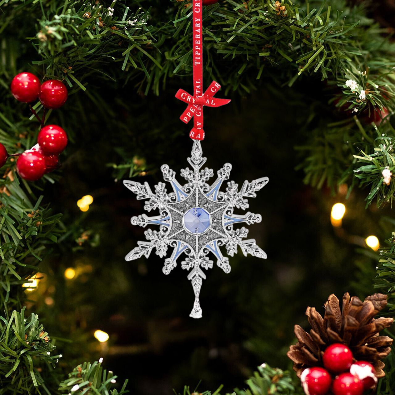 Enhance your holiday décor with the Tipperary Gem Christmas Decoration - Snowflake. Made by Tipperary, this beautiful snowflake ornament features sparkling gems that will add a touch of elegance to your tree. Perfect for adding a festive touch to your home this holiday season.