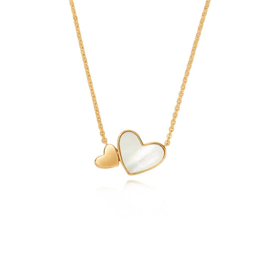 Embrace elegance with the Tipperary Heart Pendant in gold. The Mother of Pearl inset adds a touch of sophistication to this autumn 2024 piece. Make a statement with this timeless and luxurious pendant.