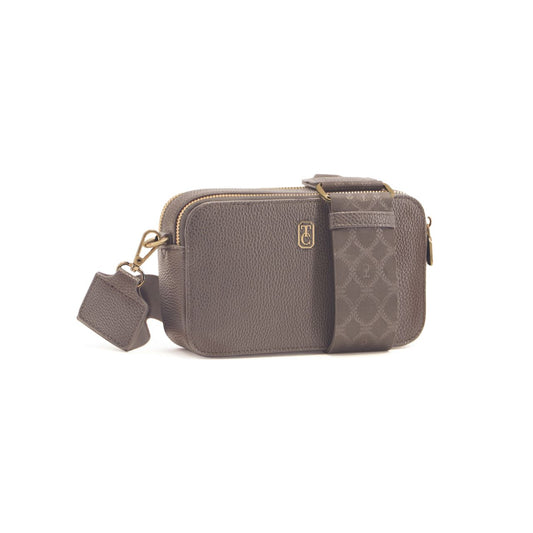 This Grey Miami Mini Crossbody by Tipperary is the perfect accessory for any on-the-go individual. With a sleek design and included shoulder strap, this bag is both stylish and convenient. Stay organized with its multiple compartments while looking your best.