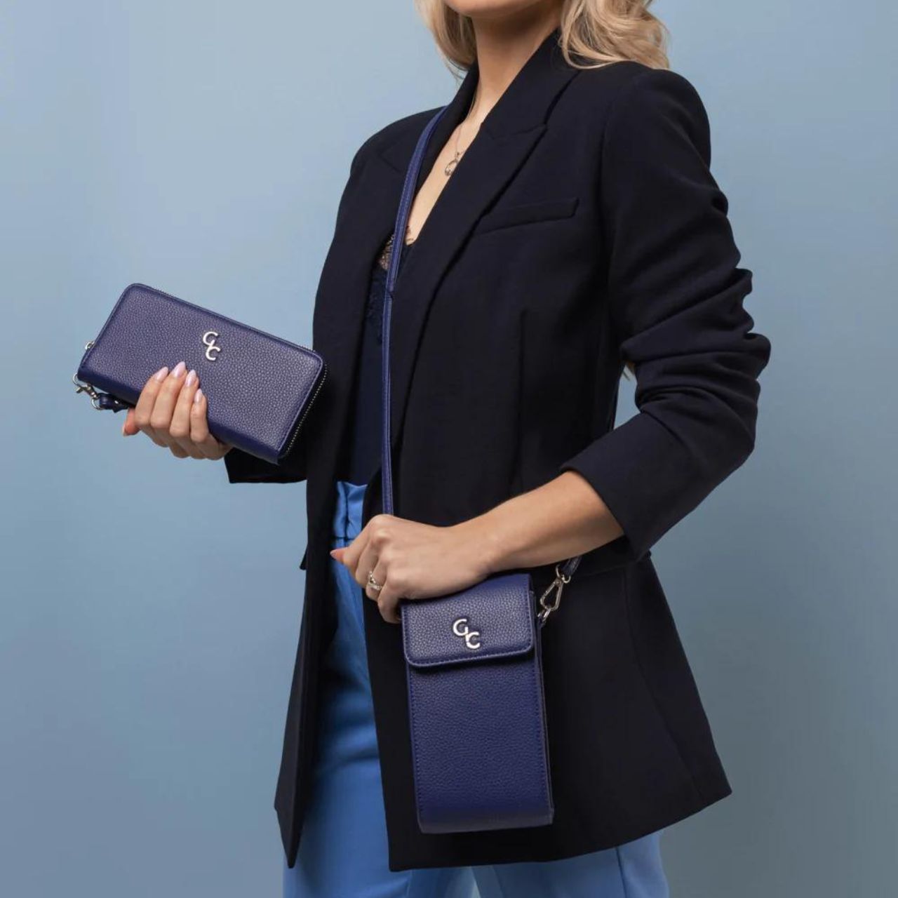 Mini Cross Bag - Navy by Galway Crystal  Introducing the new must have accessory that is truly functional. Our Light weight, Slim, Sleek, Crossbody bag is designed to hold the most essential accessory: Your mobile phone. There is nothing more liberating than carrying a lightweight bag that carries your essentials.