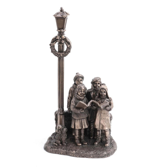 Genesis Ireland Christmas Carol Singer  A stunning ornament that is sure to bring festive cheer to your home. A beautiful bronze coloured Christmas decoration, by Genesis Ireland. Depicting a group of carol singers spreading the joy of Christmas. Let the magic of Christmas fill your home with this gorgeous sculpture for many years to come.