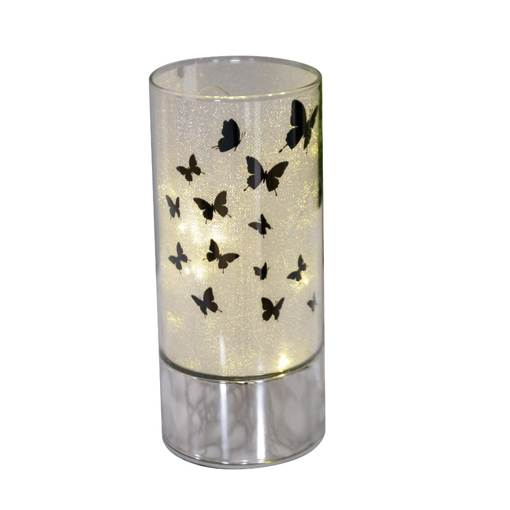 HESTIA® Glass Butterfly Design Tube with LED Lights 20cm  A beautiful LED tube from HESTIA®'s Silver Luxe collection. Featuring a dazzling glitter finish with butterfly design on a metal base. Requires 3 x AA batteries for use.