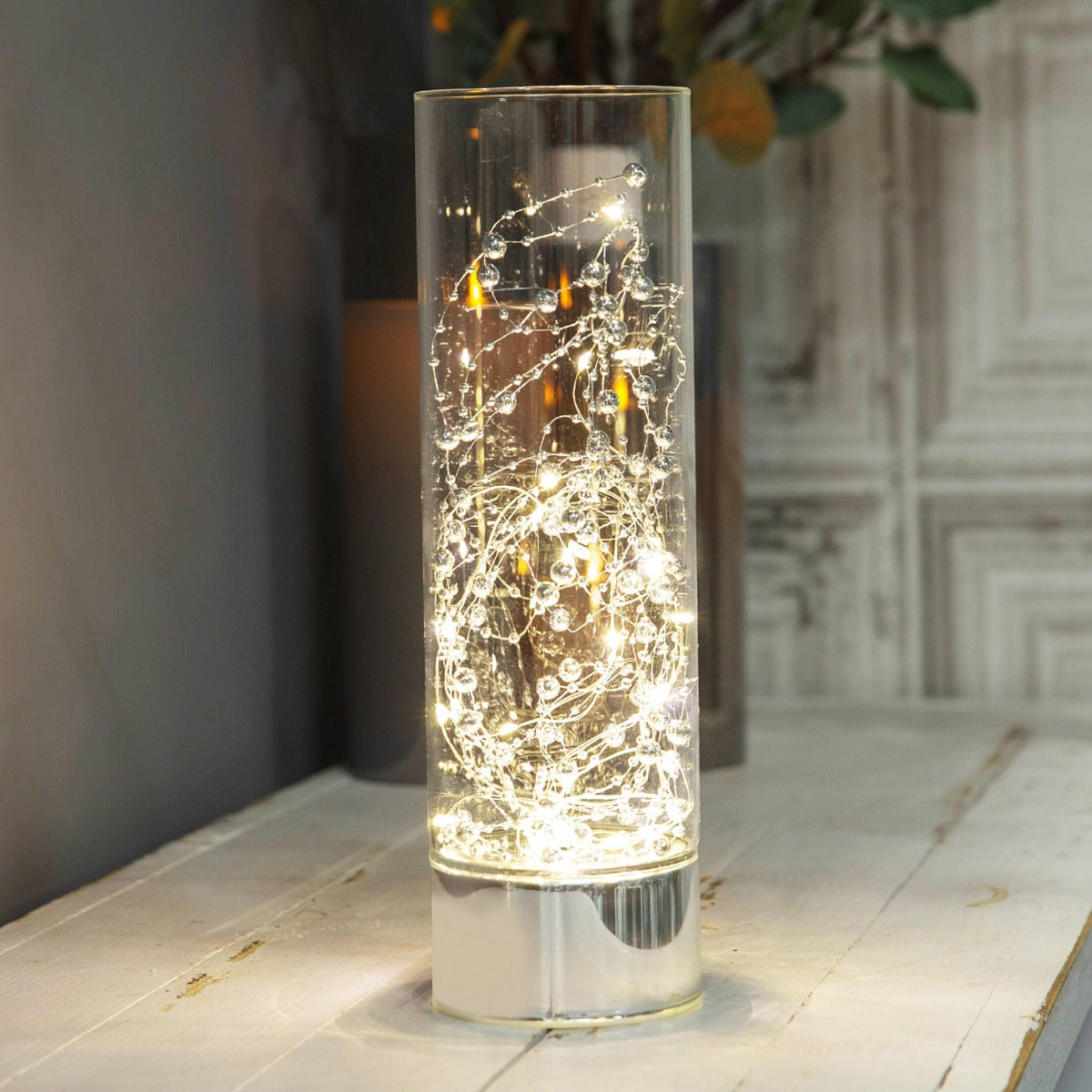 HESTIA® LED Tube Light 30cm  Bring some contemprary shimmer to your home with this elegant silver glass light tube. From the Silver Luxe collection by HESTIA® - unparalleled glamour, style and elegance in contemporary home and gift.