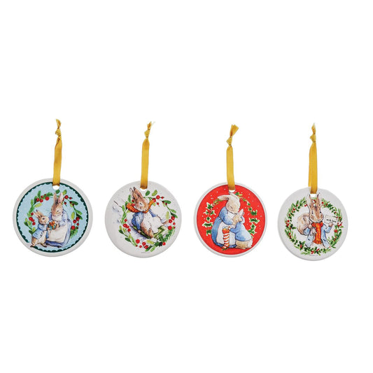 Beatrix Potter Peter Rabbit Ceramic Hanging Ornaments Set of 4  Peter Rabbit Hanging Ornaments with gold ribbon will add the spirit of Christmas to any household. With four different images, all from the original Beatrix Potter illustrations and stories, these Peter Rabbit Hanging Ornaments are extra special. Coming in a branded gift box, these make a great gift or self purchase.