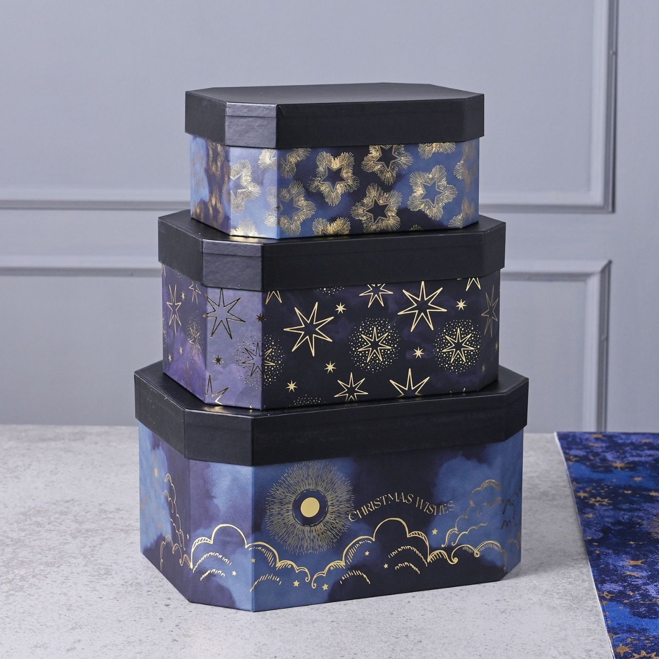 Set of 3 Christmas Celestial Stacking Boxes  A set of 3 celestial stacking boxes.  This collection of nested gift boxes gives your presents the presence they deserve.