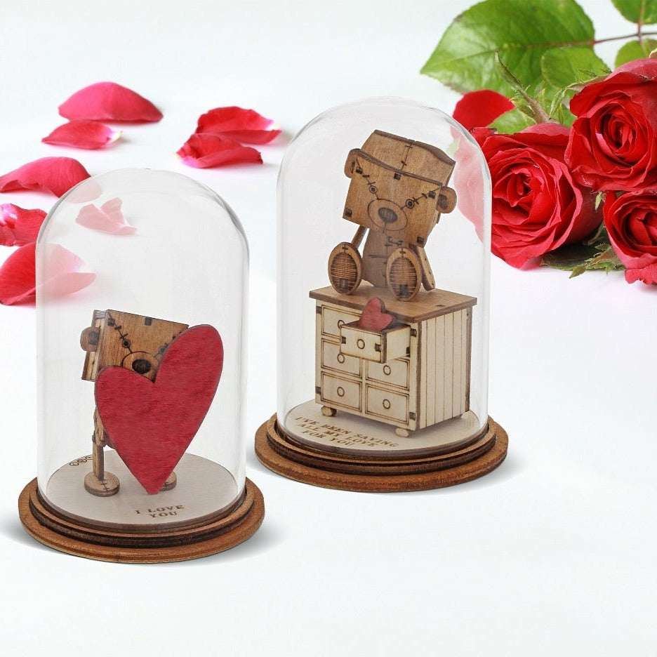 The Little Wooden Bear - I Love You Figurine  The Little Wooden Bear. This little bear will make you smile, with sentiments to suit every occasion. This glass dome decoration encases our favourite little bear, adorned a giant red love heart, ready for the one he loves.