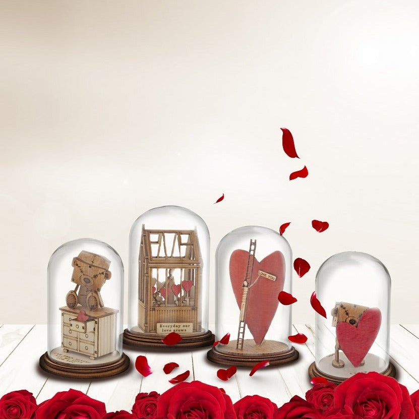 The Little Wooden Bear - I Love You Figurine  The Little Wooden Bear. This little bear will make you smile, with sentiments to suit every occasion. This glass dome decoration encases our favourite little bear, adorned a giant red love heart, ready for the one he loves.