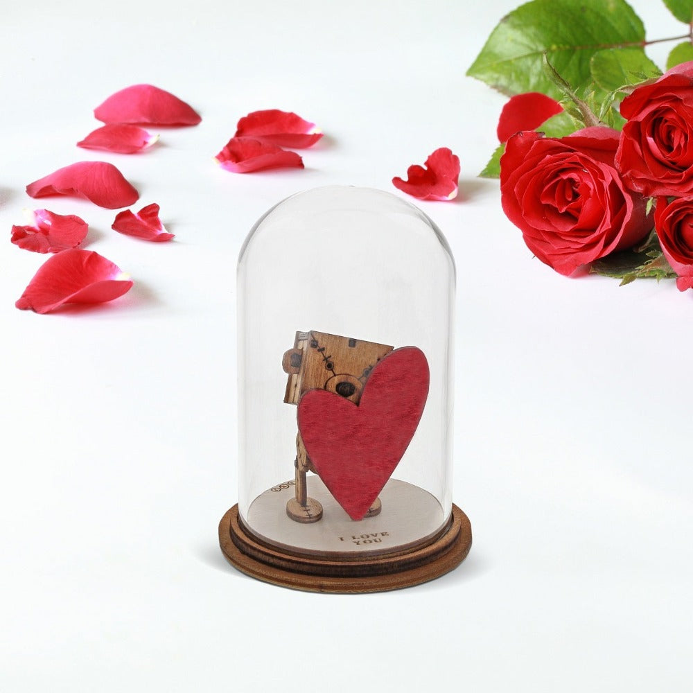 The Little Wooden Bear - I Love You Figurine  The Little Wooden Bear. This little bear will make you smile, with sentiments to suit every occasion. This glass dome decoration encases our favourite little bear, adorned a giant red love heart, ready for the one he loves.