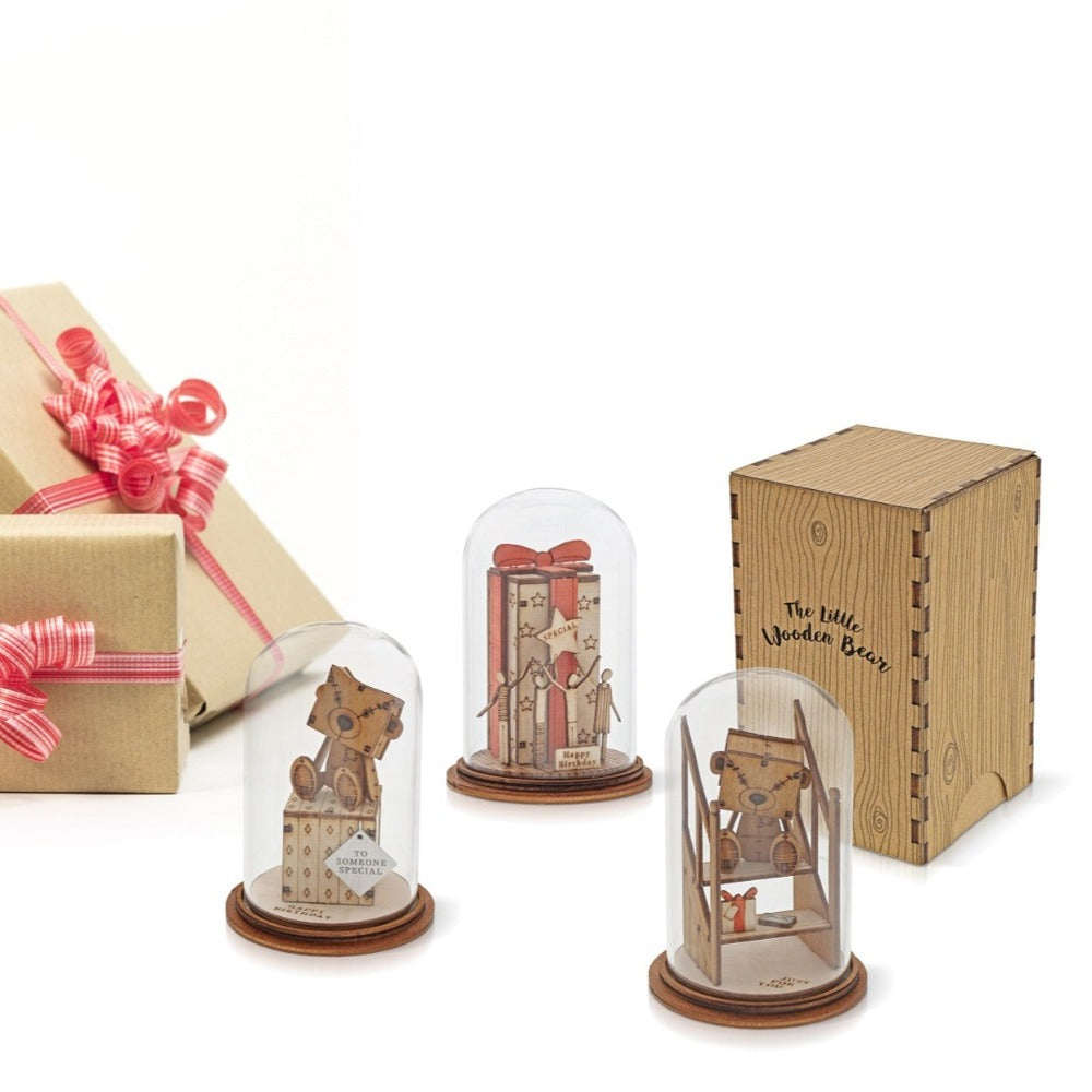 To Someone Special Figurine - The Little Wooden Bear  The Little Wooden Bear. This little bear will make you smile, with sentiments to suit every occasion. This glass dome decoration encases our favourite little bear, adorned with a giant Birthday gift.