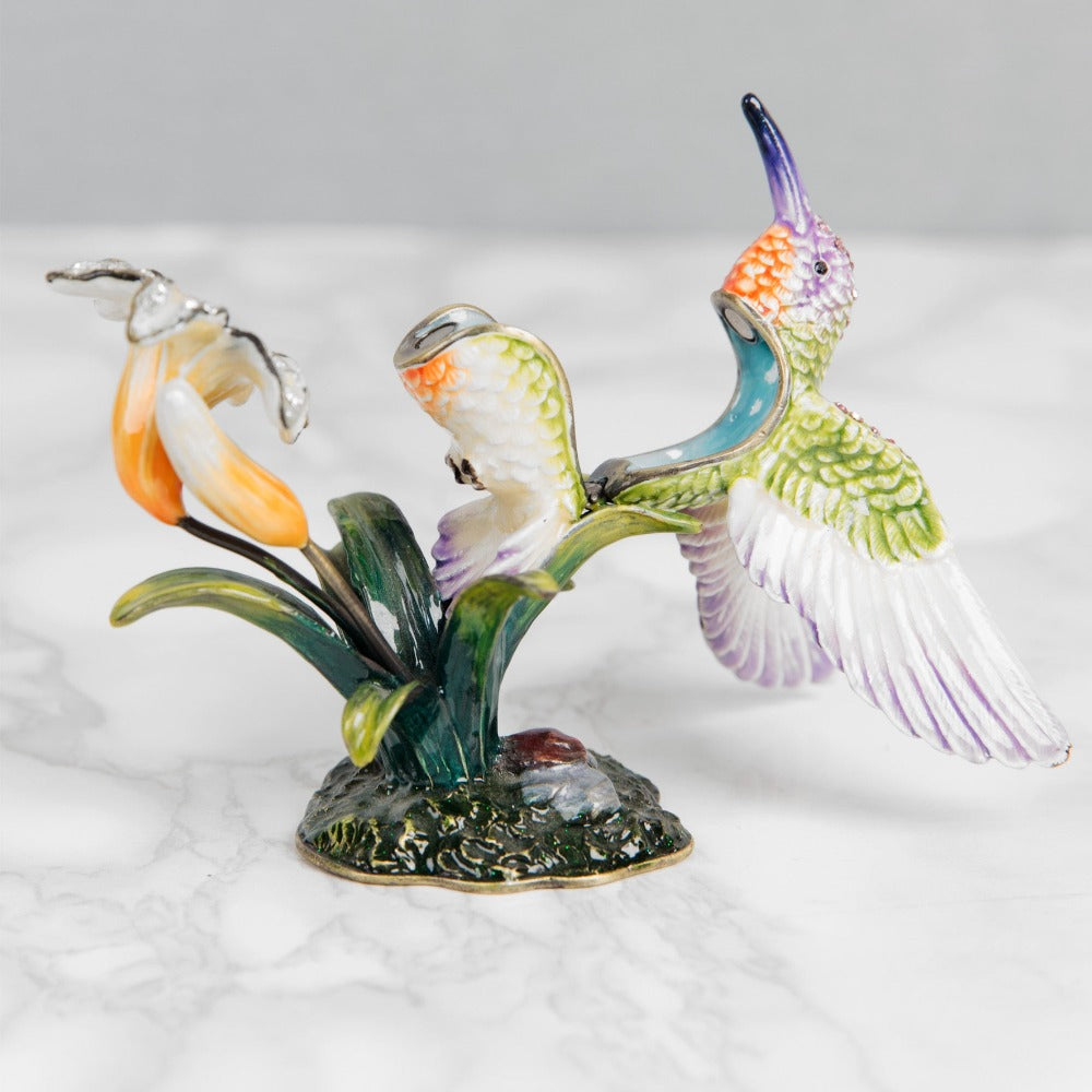 Treasured Trinkets Hummingbird  A beautiful, hand painted and crystal finished hummingbird trinket box from Treasured Trinkets.  Painted in the ethereal colours of a enchanting hummingbird, this trinket box is a wonderful ornament to complement a mantelpiece, bookcase or cabinet.