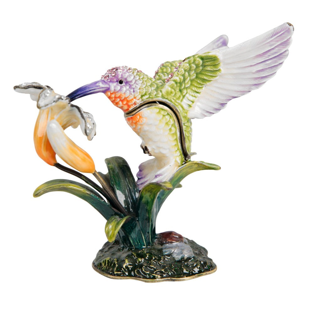 Treasured Trinkets Hummingbird  A beautiful, hand painted and crystal finished hummingbird trinket box from Treasured Trinkets.  Painted in the ethereal colours of a enchanting hummingbird, this trinket box is a wonderful ornament to complement a mantelpiece, bookcase or cabinet.